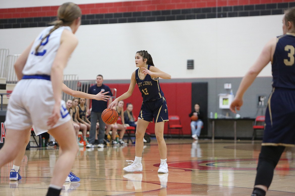 MLCA/CCS eighth-grader Graycie Kast, center, scored four points in under a minute to start a late Lion rally that sent the game to overtime.