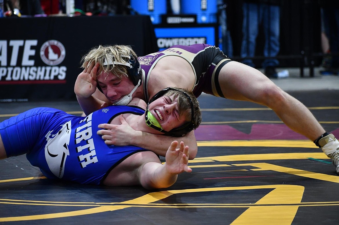 Wildcat Jayce Garcia's opponent reaches out for help during a match at the state tournament last weekend.