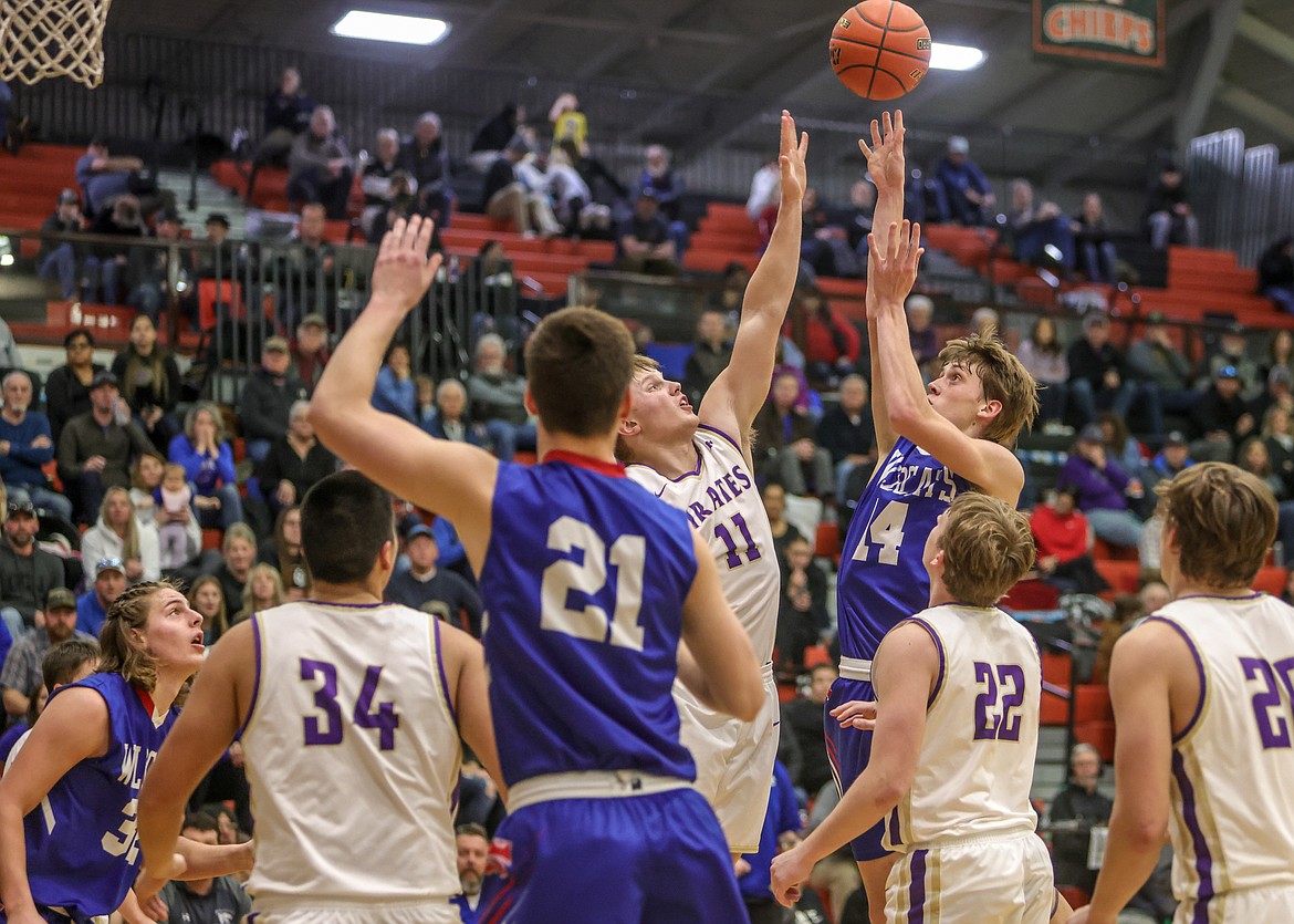 Junior Jace Hill shoots against Polson on Friday in the Western A Divisional Tournament in Ronan. (JP Edge photo)