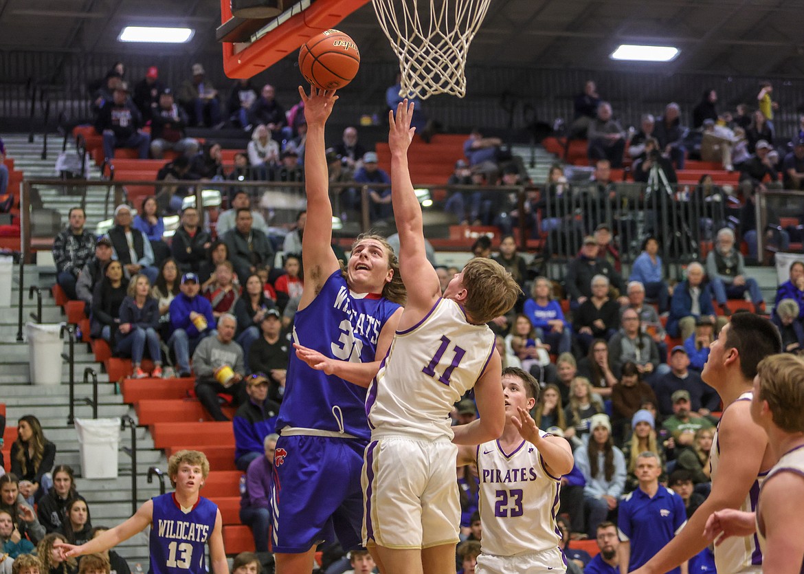 Junior Cody Schweikert goes for a lay up in Ronan in the Western A Divisional Tournament on Friday. (JP Edge photo)