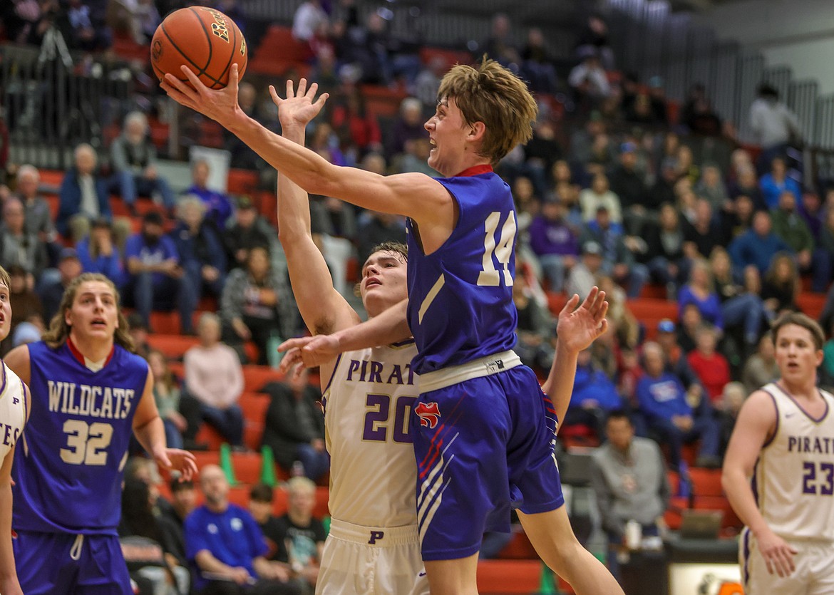 Junior Jace Hill jumps towards the basket on Friday in the Western A Divisional Tournament. (JP Edge photo)