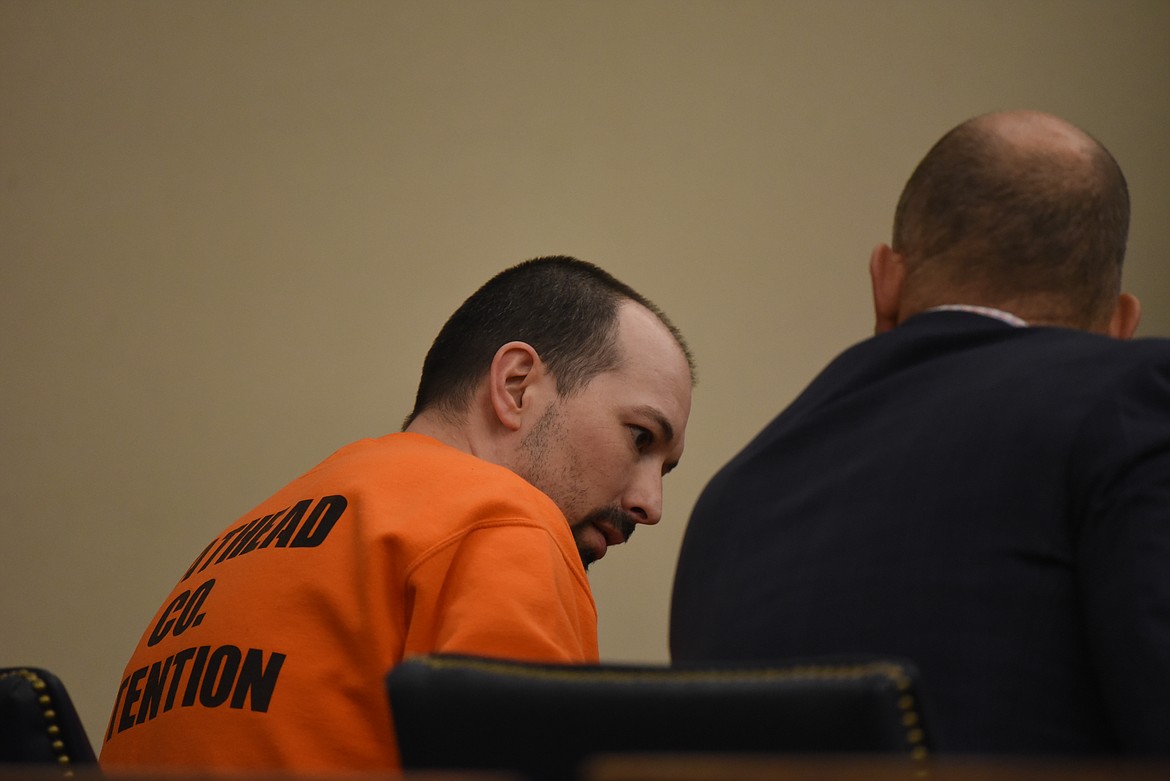 Grant Alan West speaks with defense attorney Timothy Wenz at a 2022 appearance in Flathead County District Court. (Derrick Perkins/Daily Inter Lake)