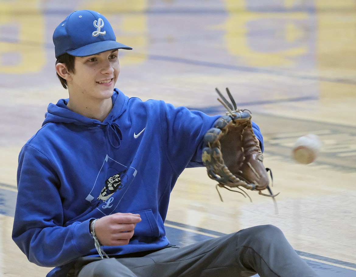 Libby Loggers American Legion baseball player Aidan Rose plays catch in the first practice on Feb. 23 at the Libby High School gym. (Paul Sievers/The Western News)