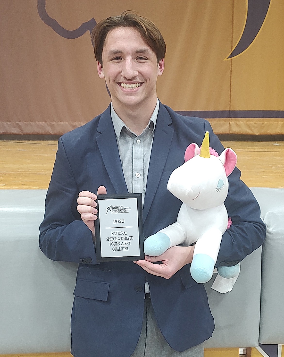 Polson Speech and Debate's Kai McDonald (shown here with team mascot Butterfingers) won first at the National Speech and Debate Association District Qualifier in Missoula, making him the first-ever student from the Polson School District to qualify for the national competition.