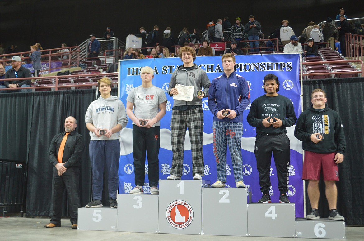 Priest River's Matyus McLain, pictured on top of the podium, won the 2A Idaho State Championship in the 220 weight-class.