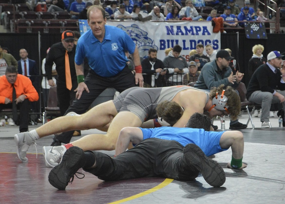 Caeden McLaimtaig (138), pictured on top, took home second place for the Spartans at the State Championships.