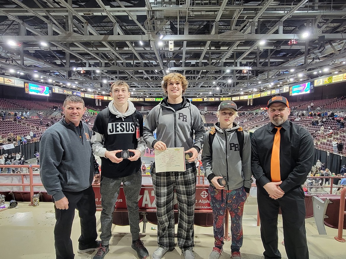 Pictured from left to right,  assistant coach Randy Poirier, Caeden McLaimtaig, Matyus McLain, Hayden Sorbel, and head wrestling coach Quinton Holbrook