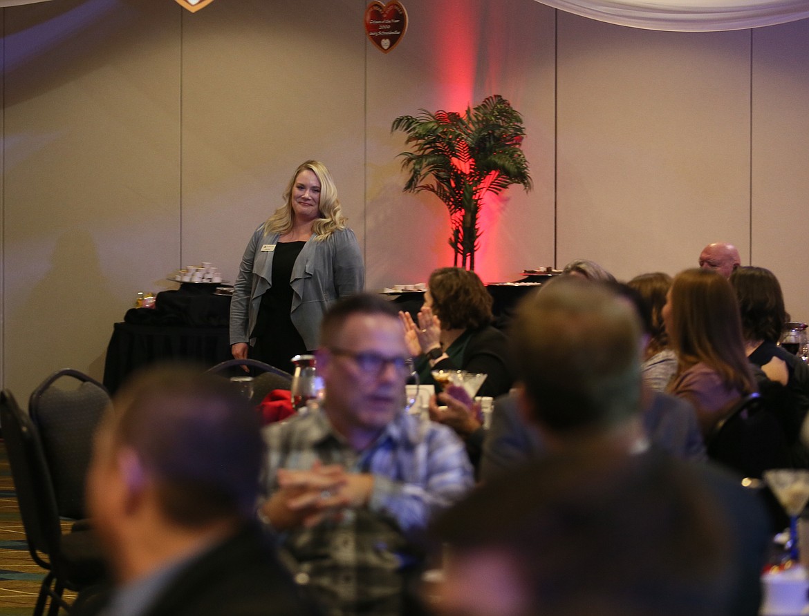 Attendees applaud Katie Huff of the Murray Group as she makes her way to the stage to accept her 2023 Volunteer of the Year Award on Tuesday evening during the Post Falls Chamber's Community Recognition Gala.