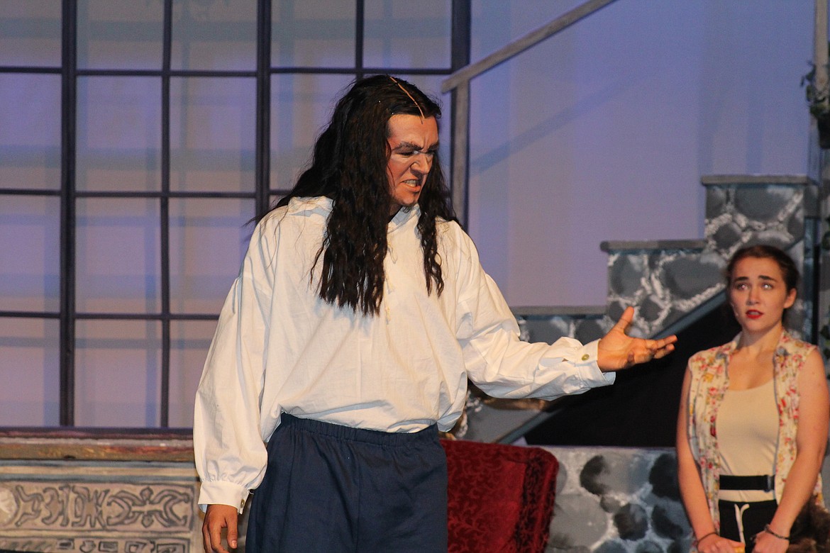 Despairing and alone, the Beast (Abraham Ramirez) is enraged to find an intruder in his house. The Quincy High School production of “Beauty and the Beast” opens tomorrow and runs for two weekends.