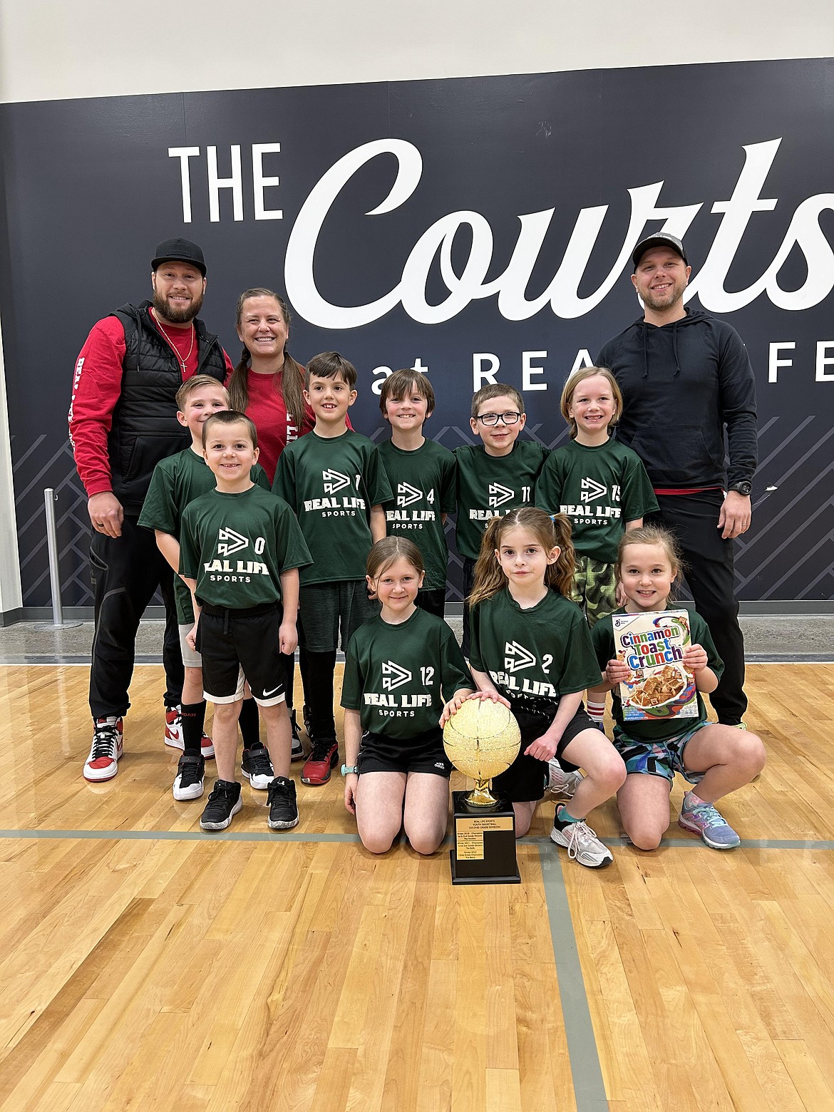 Courtesy photo
The Hunters won 1st/2nd Grade basketball championship for Real Life Sports. In the front row from left are Simon Hegstad, Margaret Pelphrey and Hailey Olberding; second row from left, Cole Mayfield, Jameson Beierle, Brock Teal, Cooper Norris, Gage Degel and Boone Eberlin; and back row from left, coaches Cody and Noelle Beirle, and Ryne Eberlin. Not pictured is Lincoln Bailey.