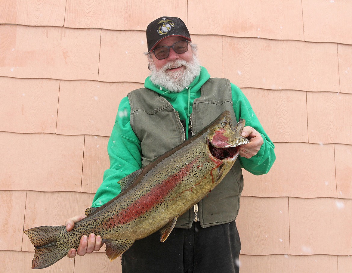 Angler catches trophy rainbow trout