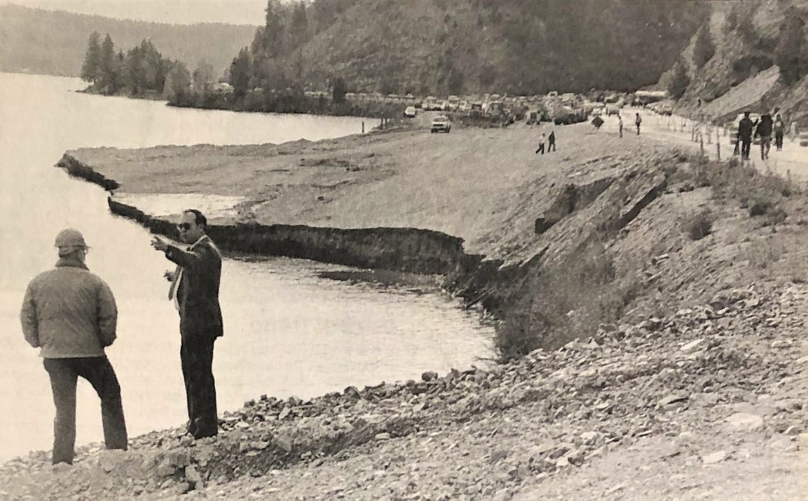 On May 17, 1990, ITD official Jim Richards and ISP Capt. Ed Strickfadden inspect damage caused by a cave-in at Higgens Point.