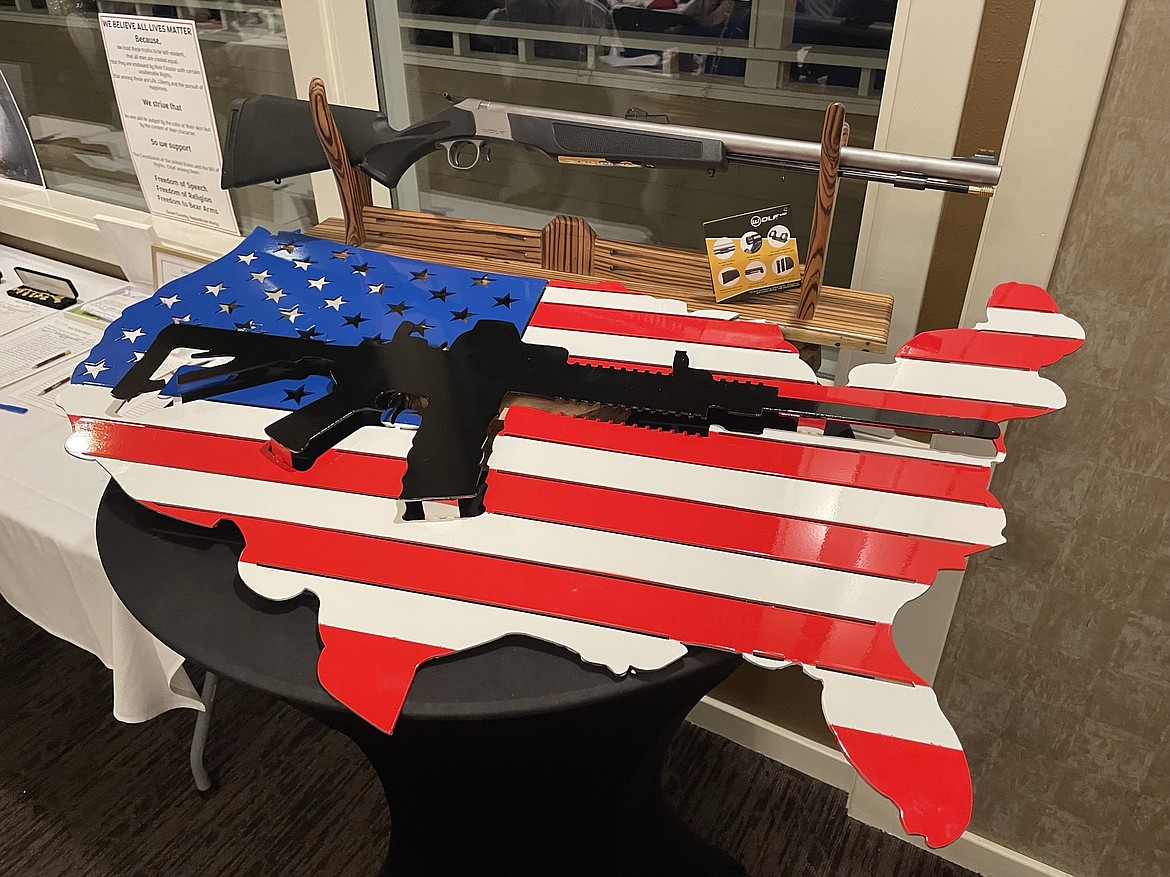 Two of the items on auction at the Grant County Republican Party’s annual Lincoln Day dinner on Saturday — above, a .50-caliber muzzle-loading rifle, and below, an American flag sculpture.