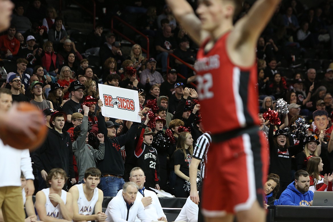 Bronco fans in the stands at Spokane Arena cheer after a made three-pointer.