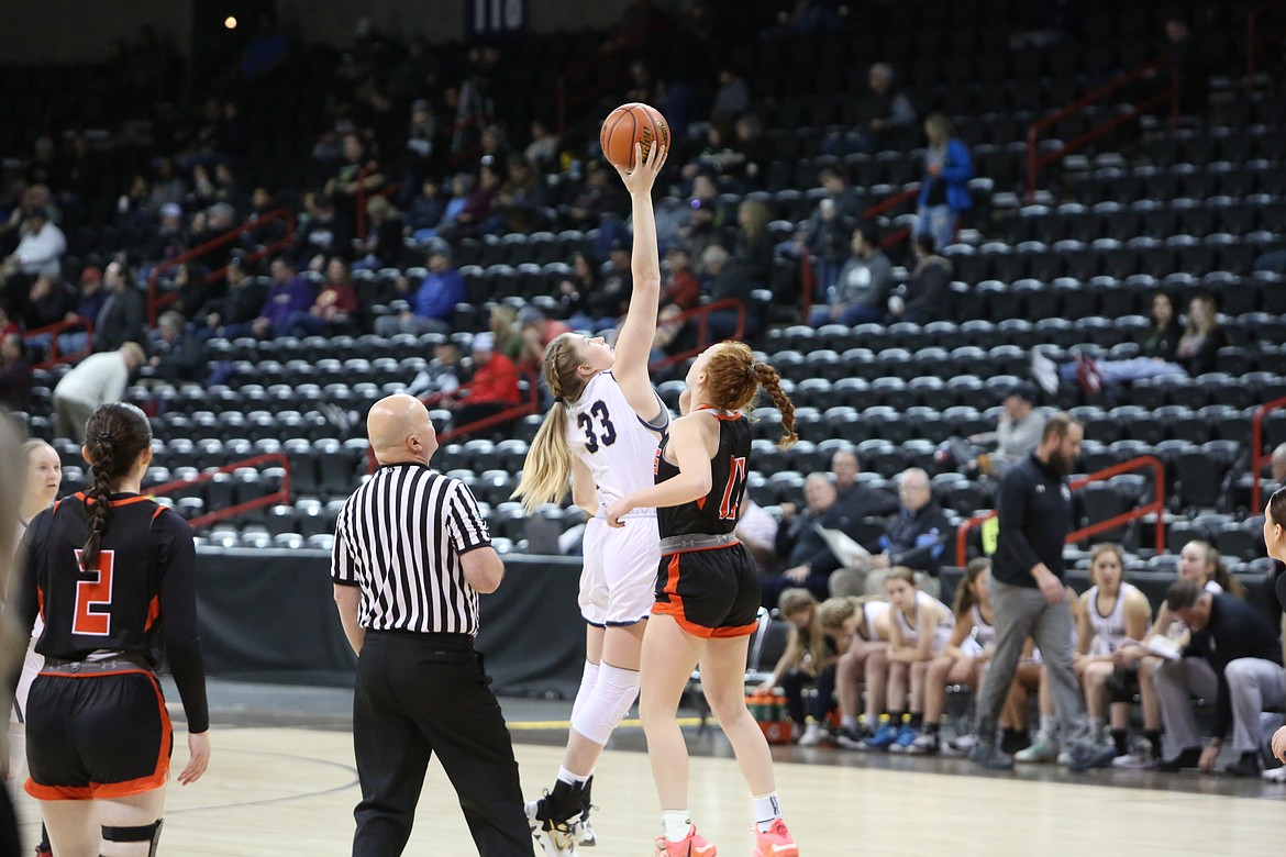 MLCA/CCS senior Kali Kast (33) corrals the opening tip against Odessa on Wednesday in the Spokane Arena.