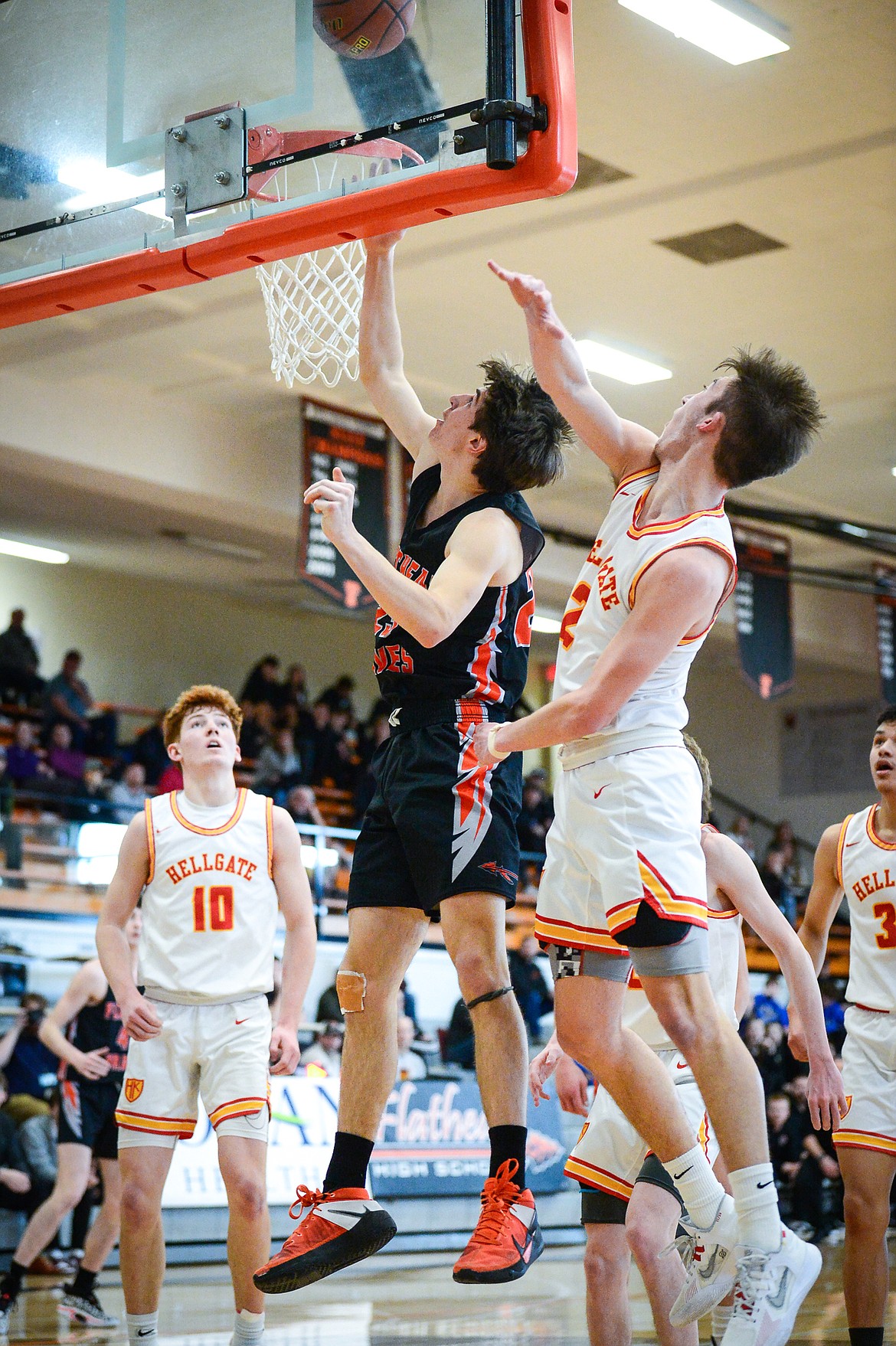 Flathead's Brody Thornsberry (23) drives to the basket in the first half against Missoula Hellgate during the Western AA Divisional Tournament at Flathead High School on Thursday, March 2. (Casey Kreider/Daily Inter Lake)