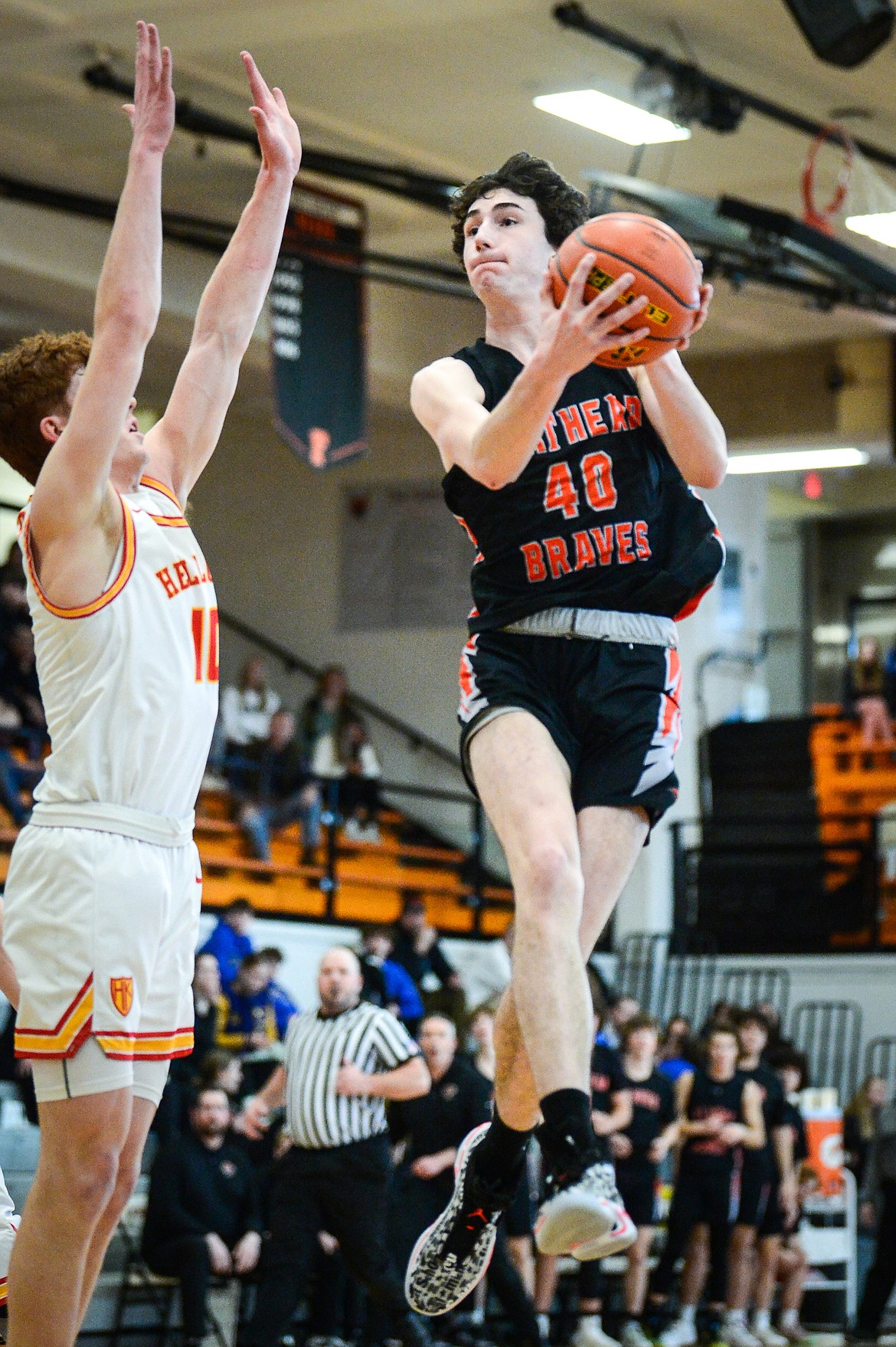 Flathead's Noah Cummings (40) drives to the basket in the first half against Missoula Hellgate during the Western AA Divisional Tournament at Flathead High School on Thursday, March 2. (Casey Kreider/Daily Inter Lake)