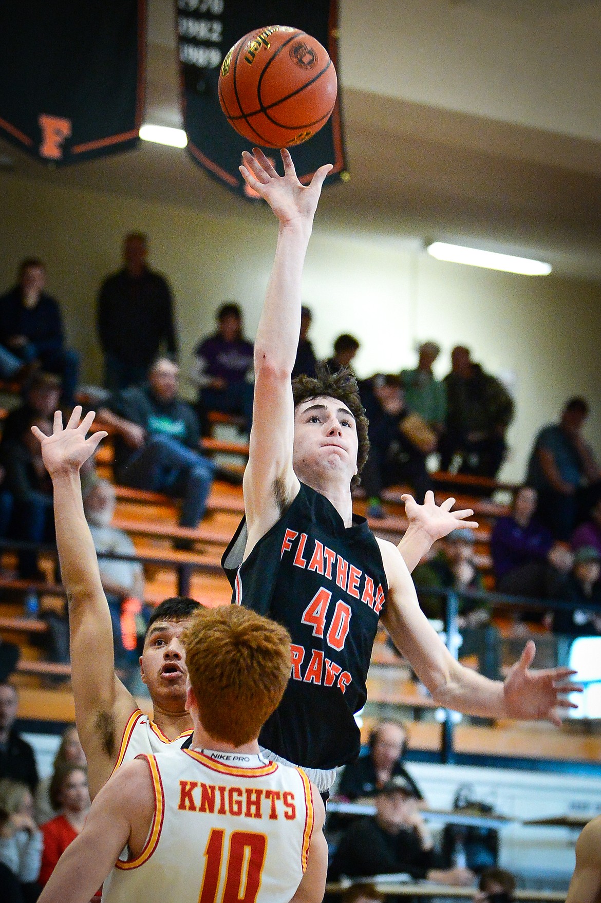 Flathead's Noah Cummings (40) drives to the basket in the first half against Missoula Hellgate during the Western AA Divisional Tournament at Flathead High School on Thursday, March 2. (Casey Kreider/Daily Inter Lake)