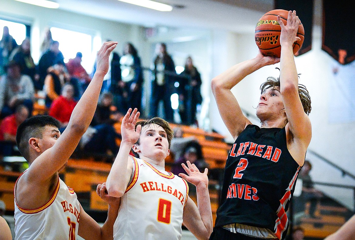 Flathead's Josh Eagleton (2) looks to shoot in the fourth quarter against Missoula Hellgate during the Western AA Divisional Tournament at Flathead High School on Thursday, March 2. (Casey Kreider/Daily Inter Lake)