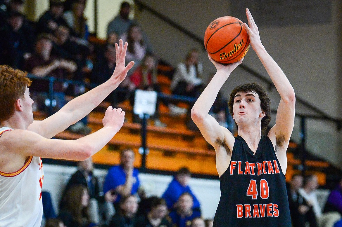 Flathead's Noah Cummings (40) looks to shoot in the second quarter against Missoula Hellgate during the Western AA Divisional Tournament at Flathead High School on Thursday, March 2. (Casey Kreider/Daily Inter Lake)