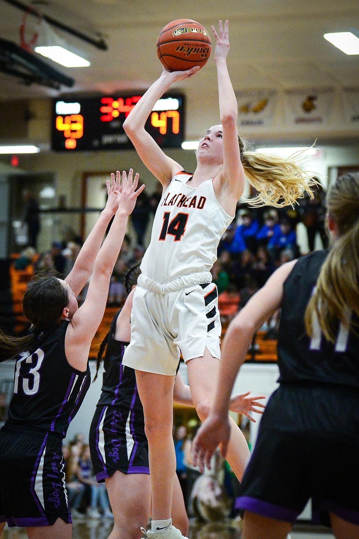 Flathead's Kennedy Moore (14) knocks down a jumper in the fourth quarter against Butte during the Western AA Divisional Tournament at Flathead High School on Thursday, March 2. (Casey Kreider/Daily Inter Lake)