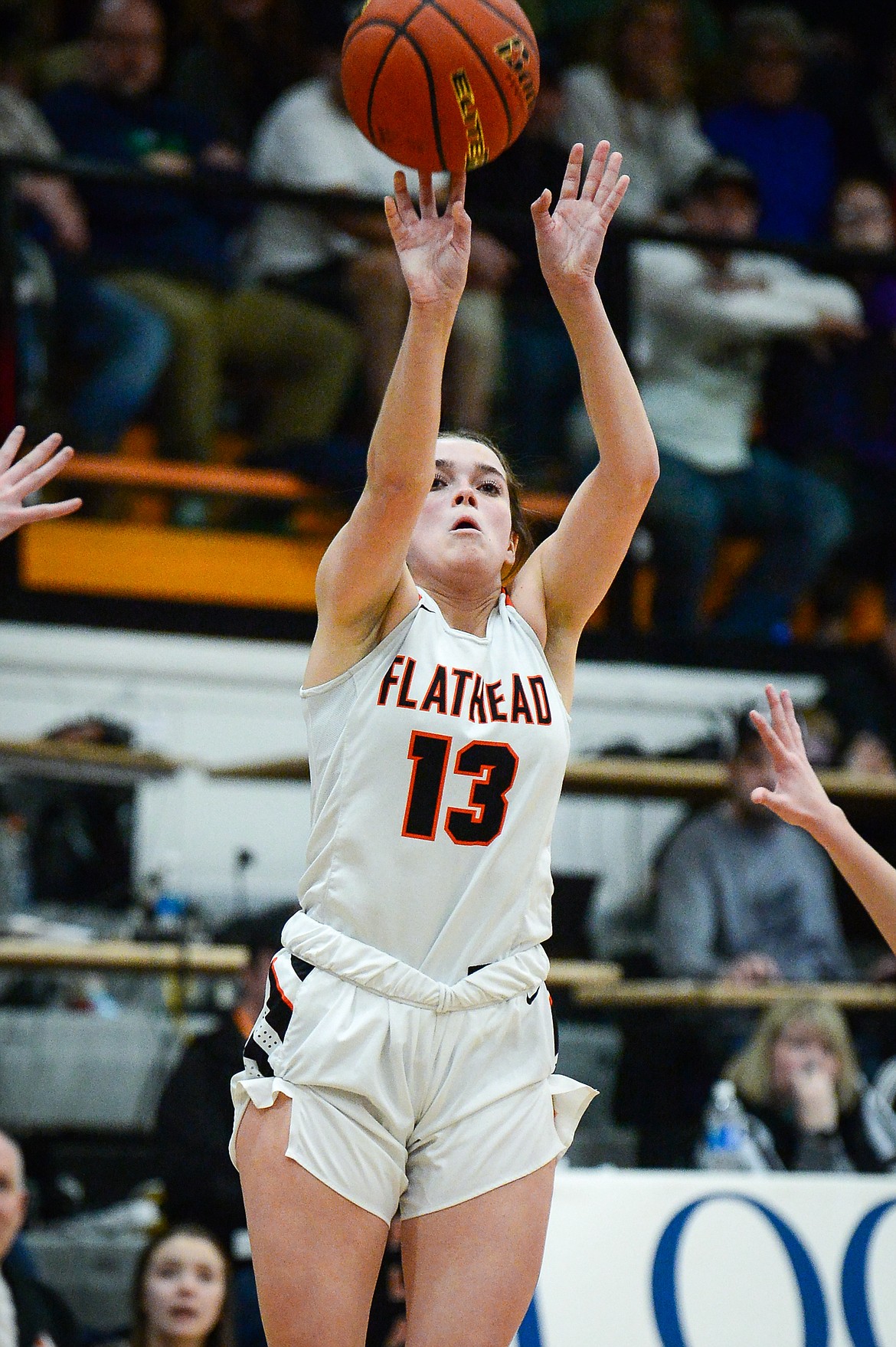 Flathead's Avery Chouinard (13) shoots a three in the fourth quarter against Butte during the Western AA Divisional Tournament at Flathead High School on Thursday, March 2. (Casey Kreider/Daily Inter Lake)