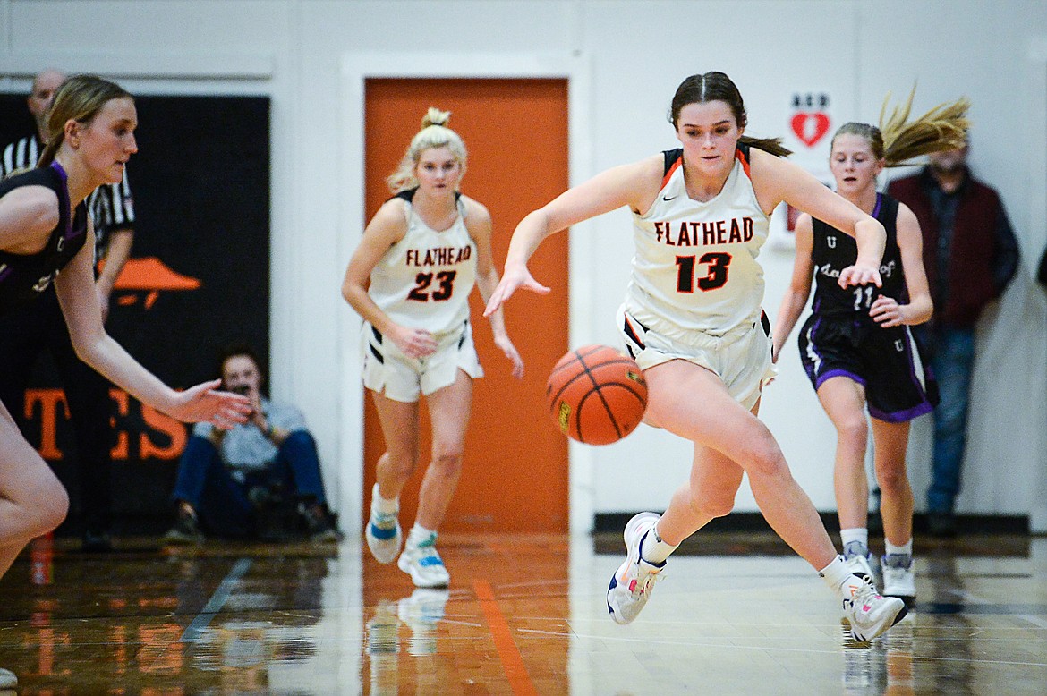 Flathead's Avery Chouinard (13) scoops up a steal in the fourth quarter against Butte during the Western AA Divisional Tournament at Flathead High School on Thursday, March 2. (Casey Kreider/Daily Inter Lake)