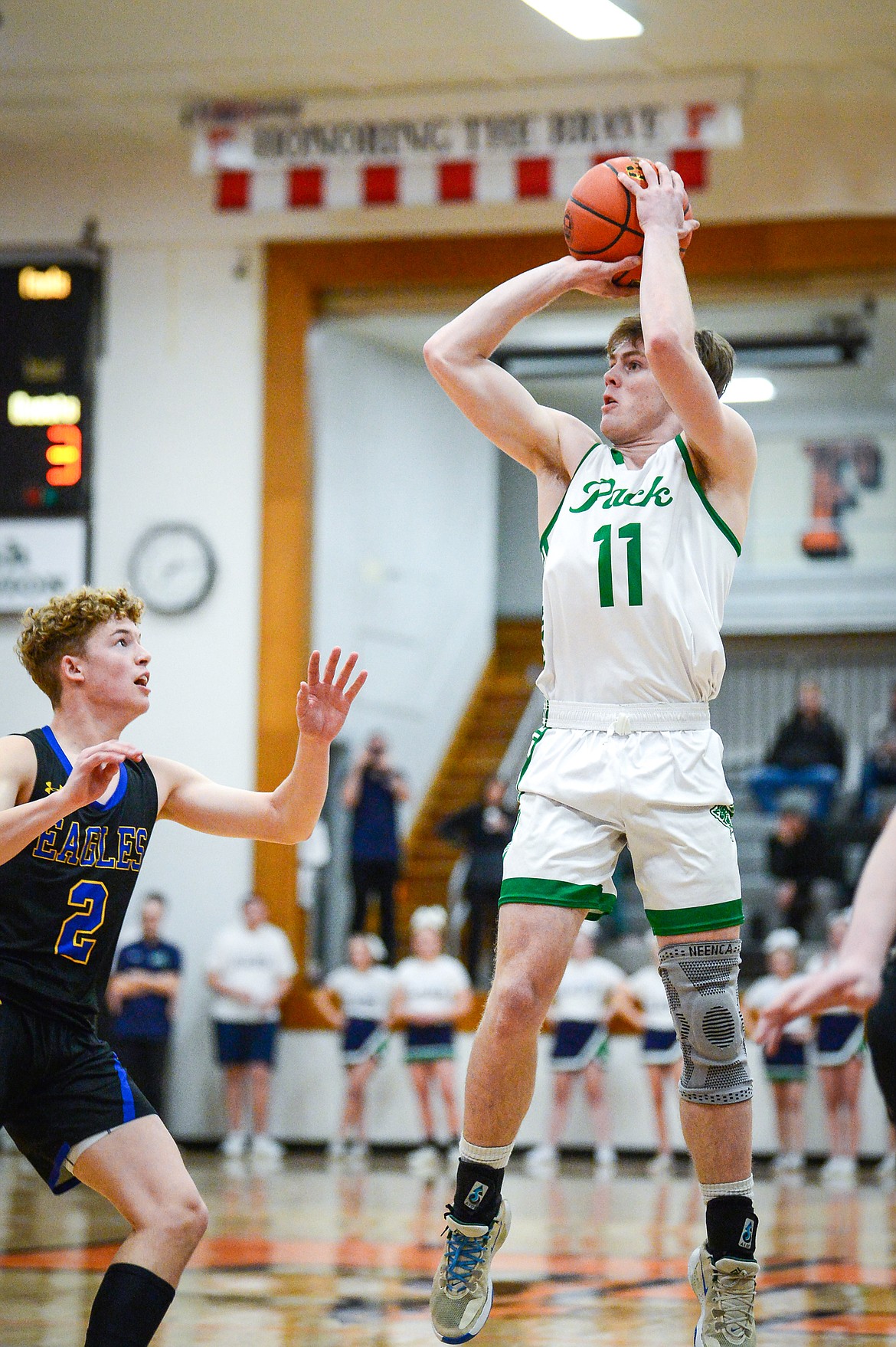 Glacier's Xavier Stout (11) knocks down a jumper in the first half against Missoula Big Sky during the Western AA Divisional Tournament at Flathead High School on Thursday, March 2. (Casey Kreider/Daily Inter Lake)