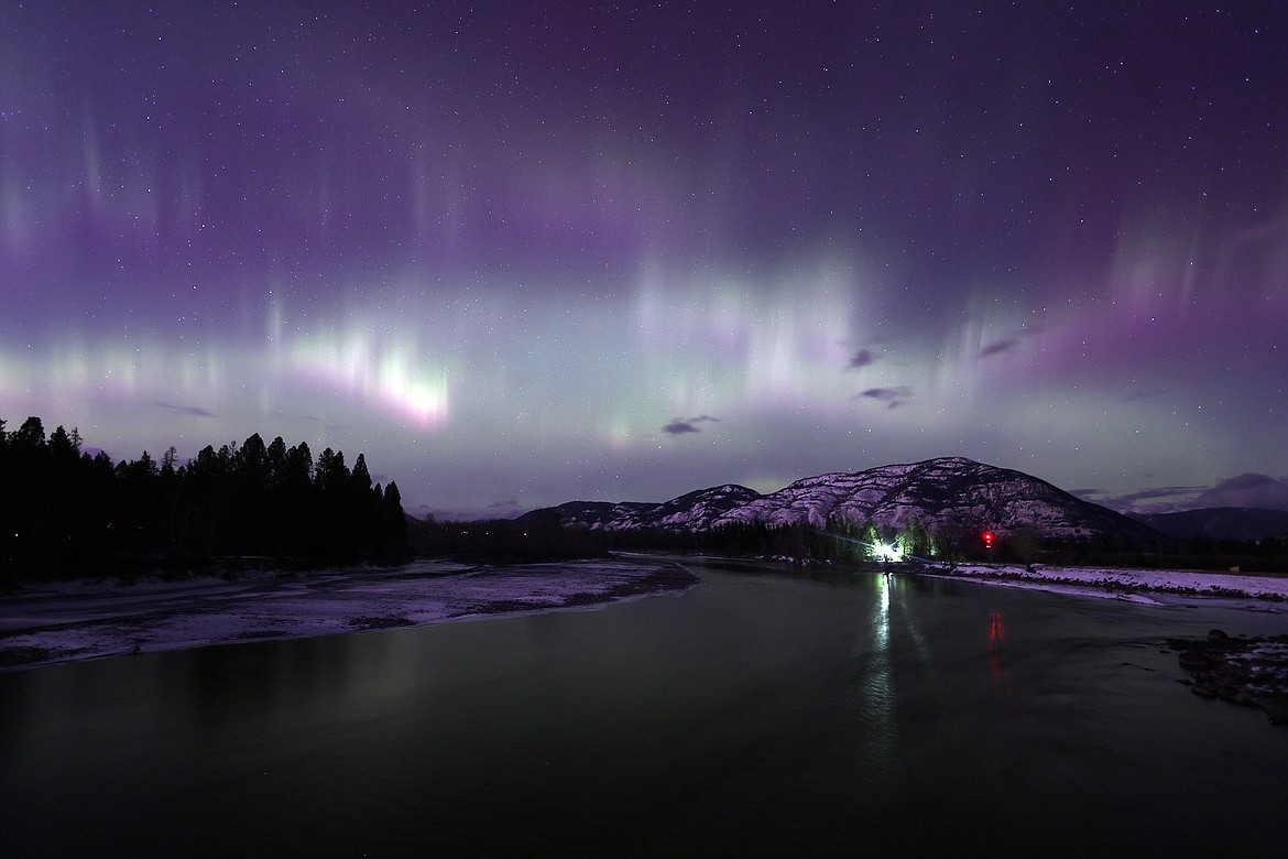 The aurora fills the skies above the Flathead River in Columbia Falls early Monday morning, Feb. 27. (Jeremy Weber/Daily Inter Lake)