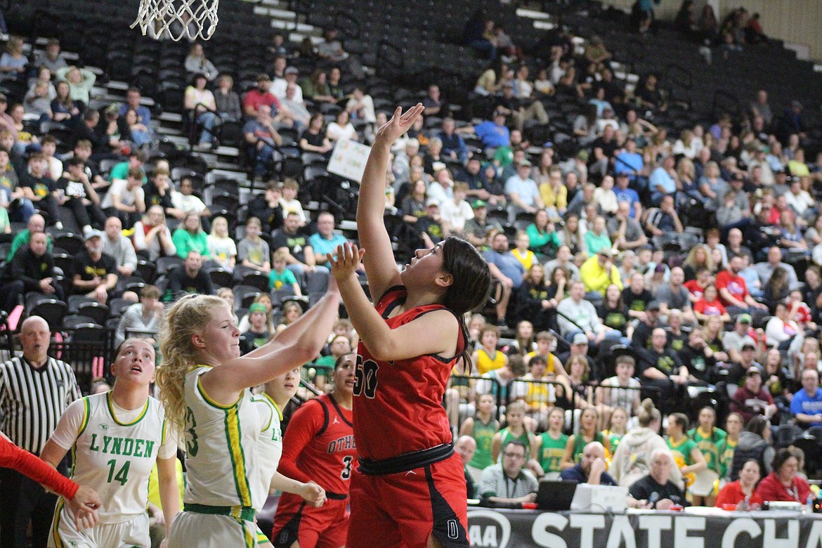 Othello’s Emi Pruneda (50) puts the ball up in the Huskies’ 33-31 2A girls state tournament win.
