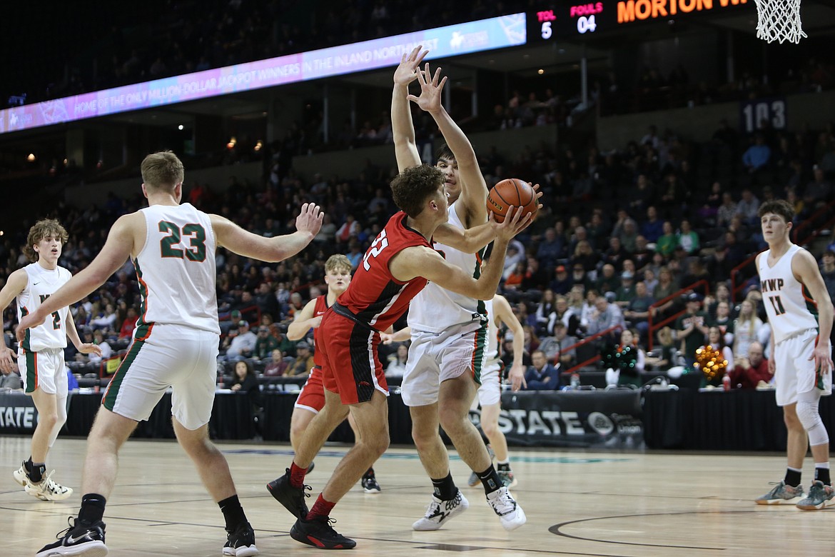 LRS senior Chase Galbreath, in red, goes for a layup against Morton-White Pass on Thursday in the Spokane Arena. Galbreath led the Broncos in scoring with 16 points.