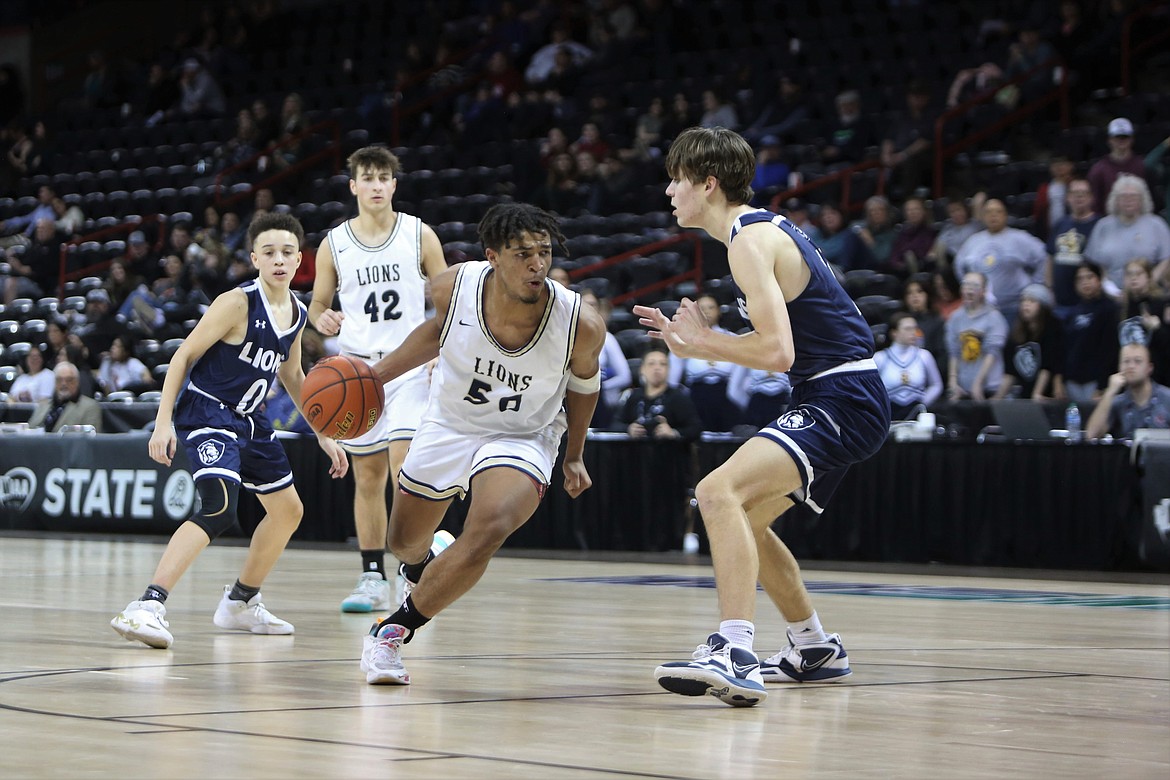 MLCA/CCS junior Caleb Jones (50) looks to get past a Sound Christian defender in the fourth quarter against the Lions.