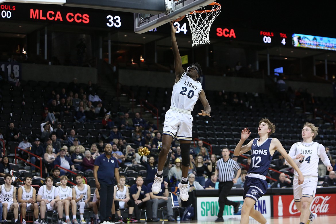 MLCA/CCS senior Jeff Boorman (20) scores on a layup in transition in the third quarter against Sound Christian.