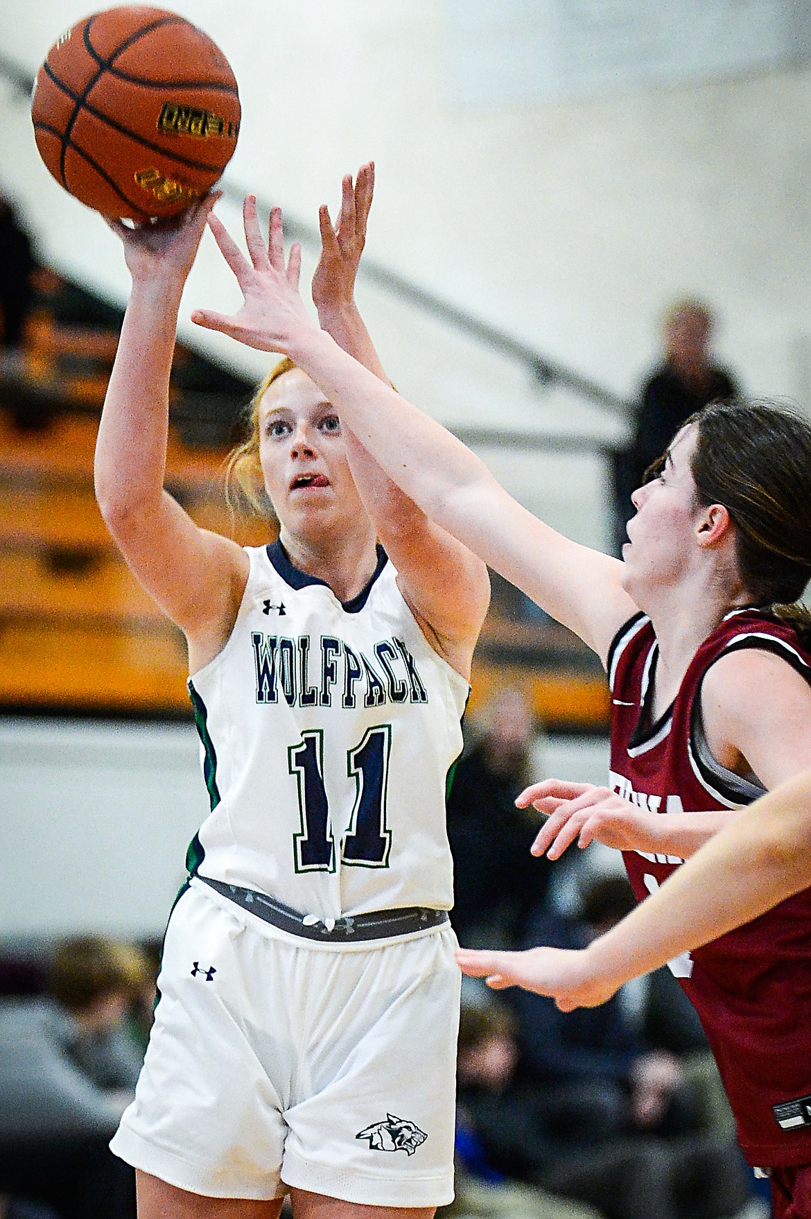 Glacier's Kenedee Moore (11) looks to shoot in the first half against Helena during the Western AA Divisional Tournament at Flathead High School on Friday, March 3. (Casey Kreider/Daily Inter Lake)