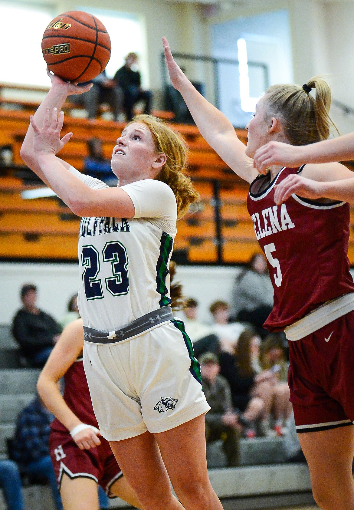 Glacier's Reese Ramey (23) drives to the basket in the first half against Helena during the Western AA Divisional Tournament at Flathead High School on Friday, March 3. (Casey Kreider/Daily Inter Lake)