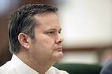 Judge splits trials of couple charged in triple murder case