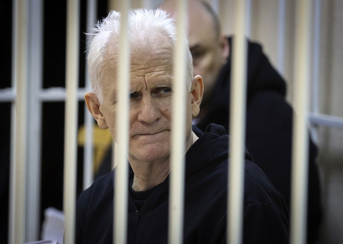 Ales Bialiatski, the head of Belarusian Vyasna rights group, sits in a defendants' cage during a court session in Minsk, Belarus, on Thursday Jan. 5, 2023. A Belarusian court has sentenced Ales Bialiatski, Belarus' top human rights advocate and one of the winners of the 2022 Nobel Peace Prize, to 10 years in prison. Bialiatski and three other top figures of the Viasna human rights center he founded were convicted of financing anti-government protests. (Vitaly Pivovarchyk/BelTA Pool Photo via AP, File)