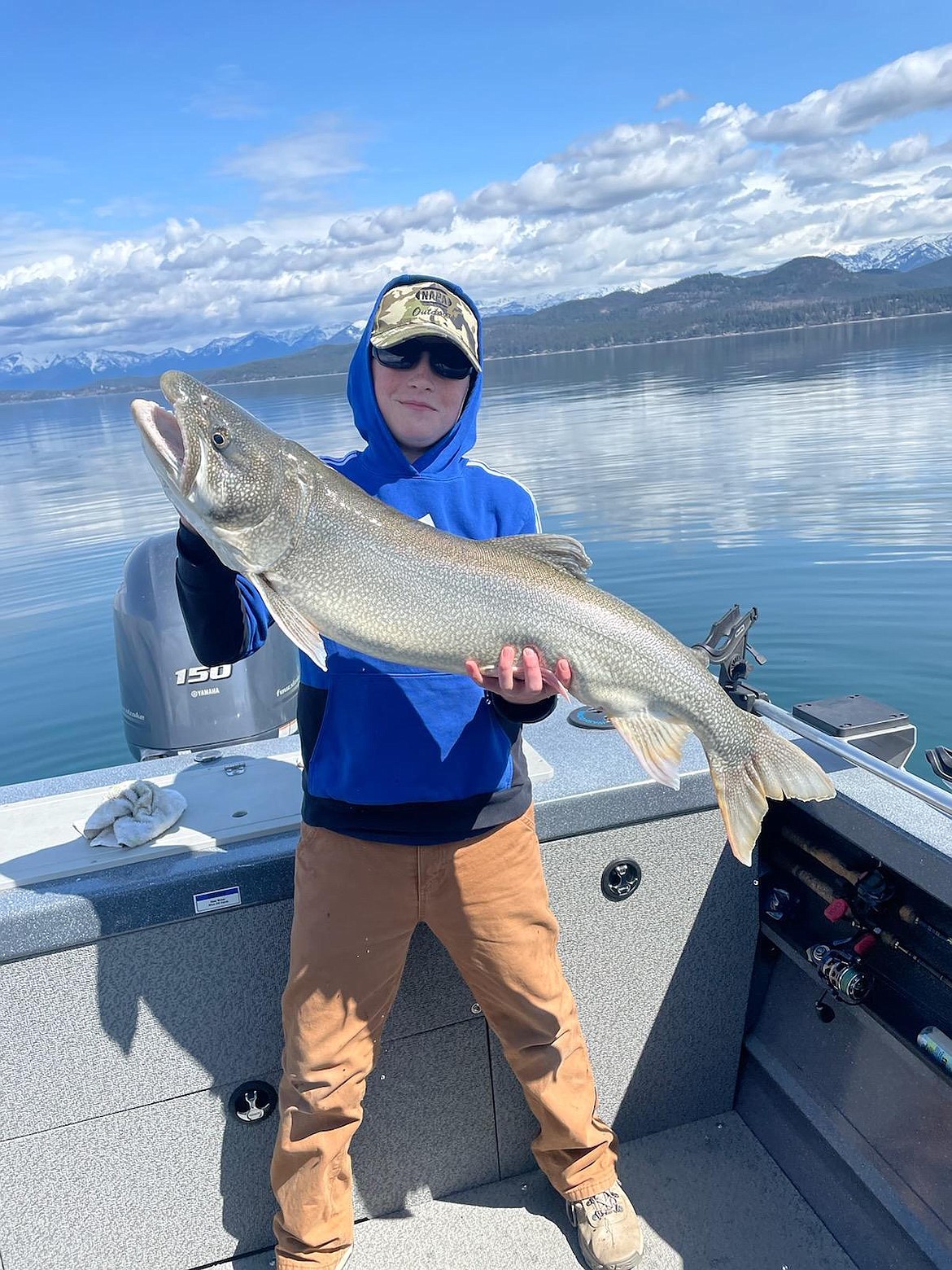 Brodie Smith shows off a 20-pound lake trout he caught in 2022. (Photo courtesy of CSKT)