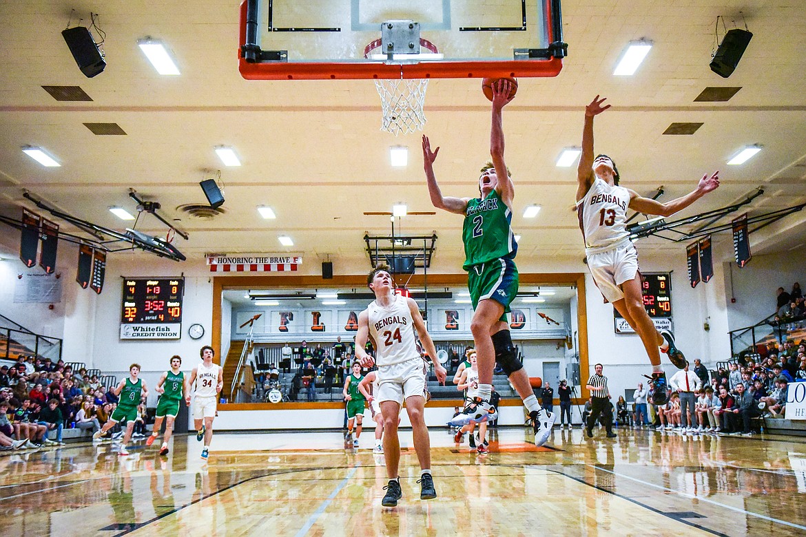 Glacier's Tyler McDonald (2) goes to the basket on a fast break in the second half against Helena in the Western AA Divisional Tournament semifinal at Flathead High School on Friday, March 3. (Casey Kreider/Daily Inter Lake)