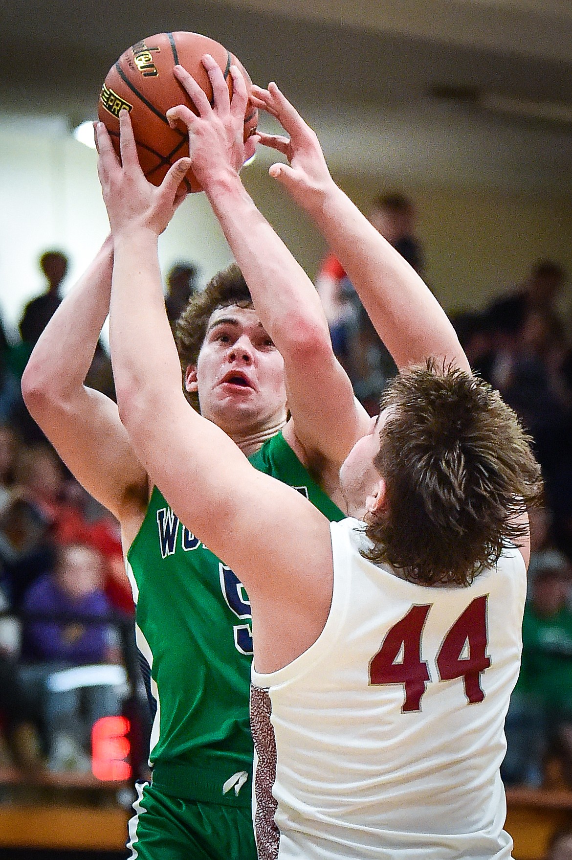 Glacier's Ty Olsen (5) drives to the basket against Helena's Dylan Christman (44) in the first half of the Western AA Divisional Tournament semifinal at Flathead High School on Friday, March 3. (Casey Kreider/Daily Inter Lake)