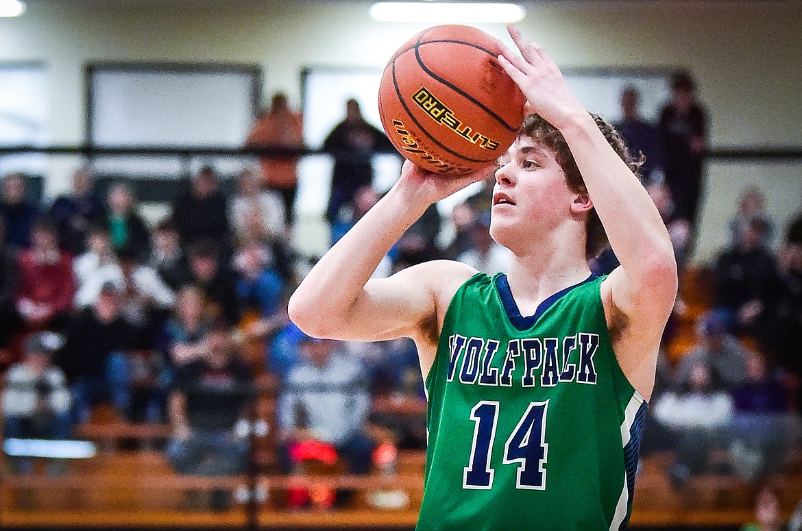 Glacier's Kaidrian Buls (14) knocks down a three in the first half against Helena in the Western AA Divisional Tournament semifinal at Flathead High School on Friday, March 3. (Casey Kreider/Daily Inter Lake)