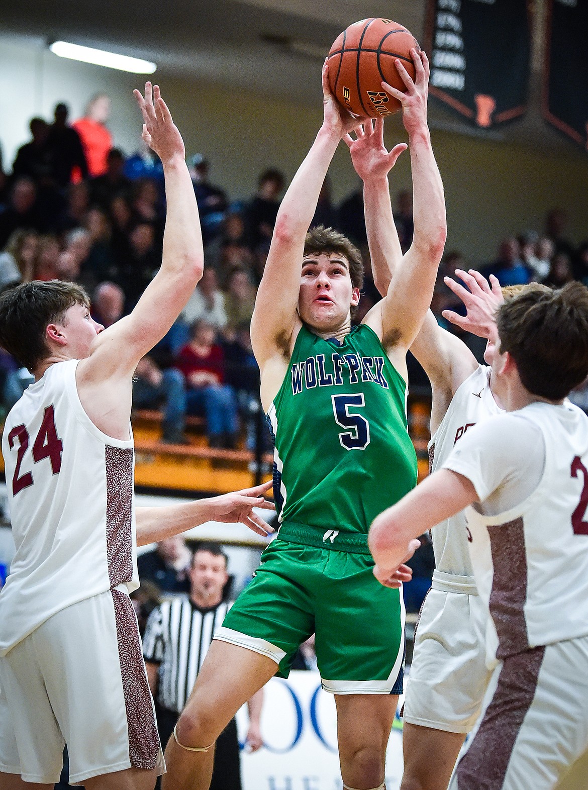 Glacier's Ty Olsen (5) drives to the basket against Helena in the first half of the Western AA Divisional Tournament semifinal at Flathead High School on Friday, March 3. (Casey Kreider/Daily Inter Lake)