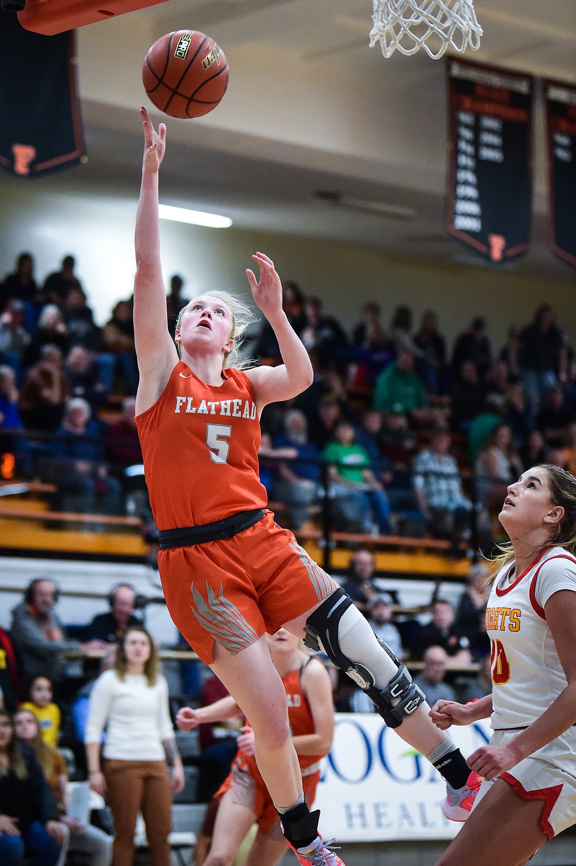 Flathead's Maddy Moy (5) drives to the basket in the first half against Missoula Hellgate in the Western AA Divisional Championship at Flathead High School on Saturday, March 4. (Casey Kreider/Daily Inter Lake)