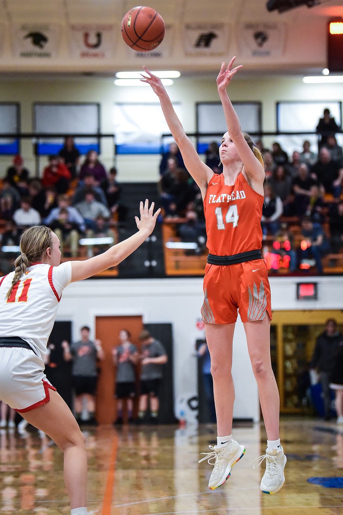 Flathead's Kennedy Moore (14) shoots a three in the first half against Missoula Hellgate in the Western AA Divisional Championship at Flathead High School on Saturday, March 4. (Casey Kreider/Daily Inter Lake)