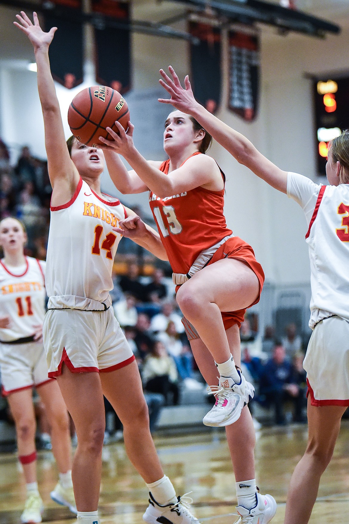 Flathead's Avery Chouinard (13) drives to the basket in the second half against Missoula Hellgate in the the Western AA Divisional Championship at Flathead High School on Saturday, March 4. (Casey Kreider/Daily Inter Lake)