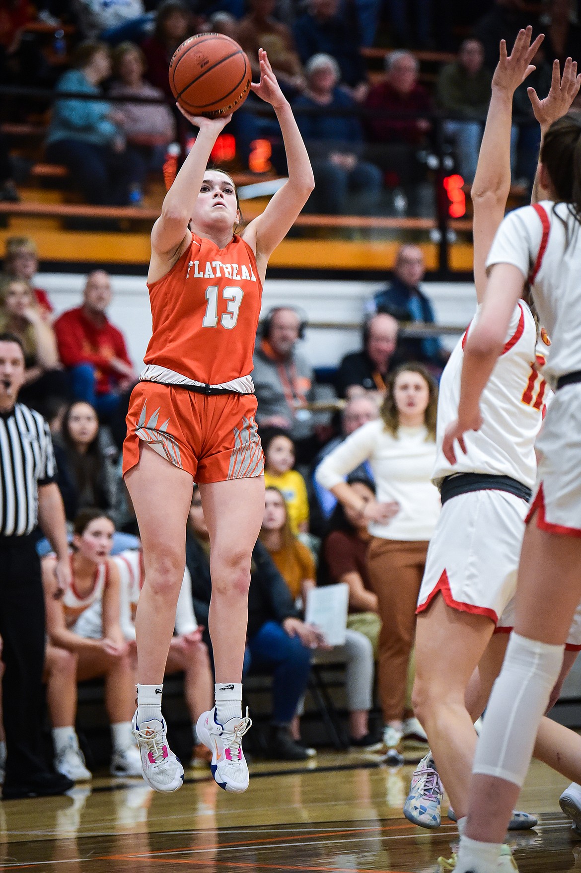 Flathead's Avery Chouinard knocks down a three in the first half half against Missoula Hellgate in the Western AA Divisional Championship at Flathead High School on Saturday, March 4. (Casey Kreider/Daily Inter Lake)