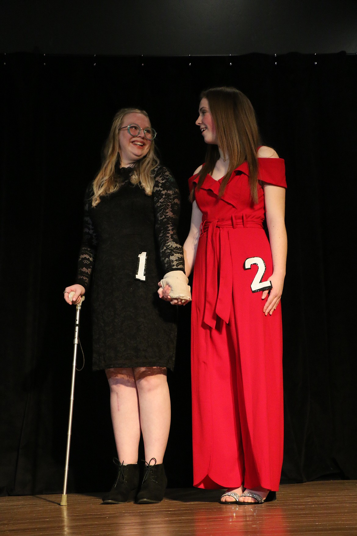 Merrell Cunningham, left, and Aurla Palmer, right, react as Palmer is announced as Sandpoint's Distinguished Young Woman for 2023.