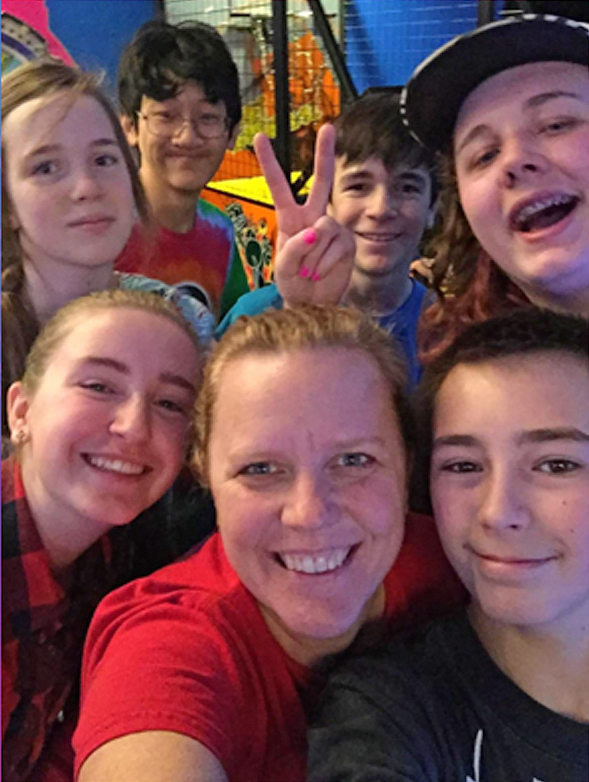 Jennifer Greve, pictured in the center, has fun with Forrest Bird Charter School students. Greve announced Friday that she will retire at the end of the school year.