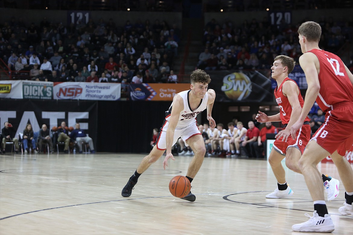 LRS senior Chase Galbreath, in white, drives toward the rim in the first quarter against Brewster on Friday.