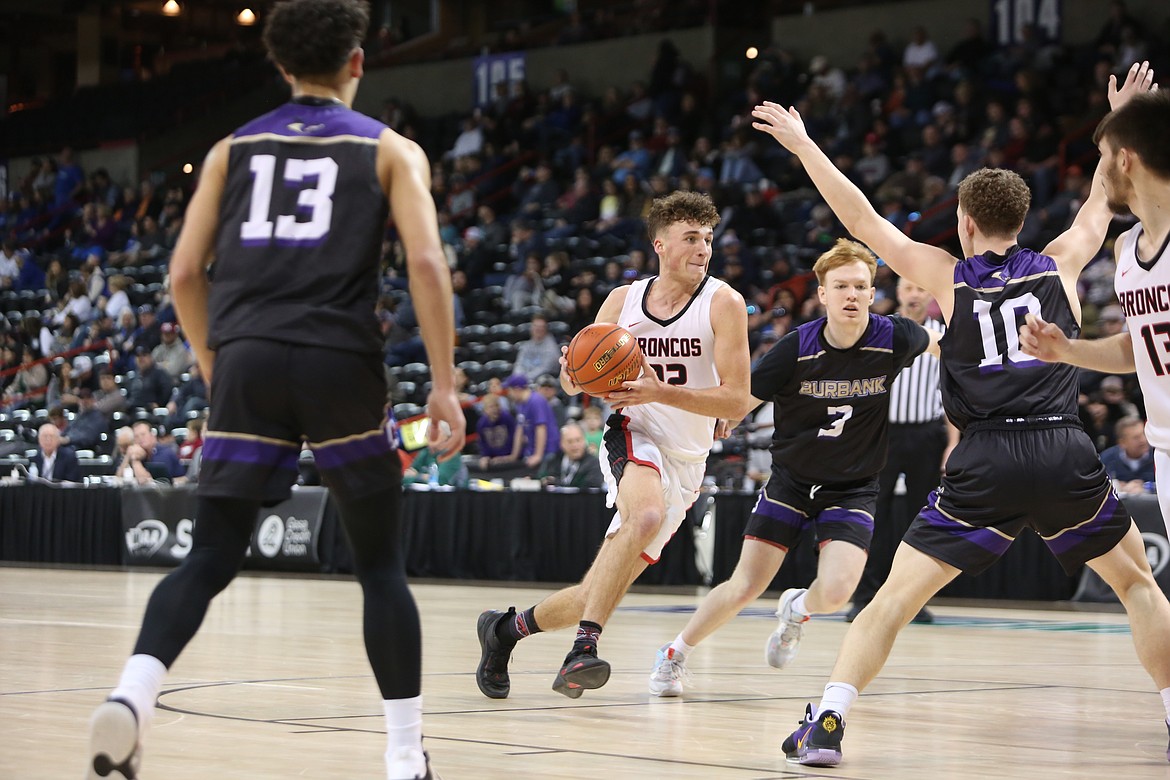 LRS senior Chase Galbreath, in white, drives through an open lane to the rim in the fourth quarter against Columbia (Burbank).